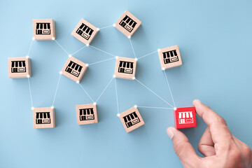 Franchise business concept,hand choose wood blog with franchise marketing.