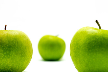Delicious green apple on a white background