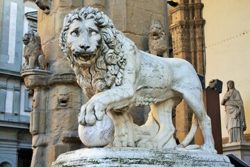 Florence, Tuscany, Italy: ancient statue of a lion in Piazza della Signoria, sculpture that depicts...