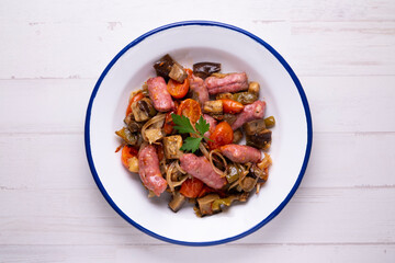 Pork salchichas with eggplant and paprika.
