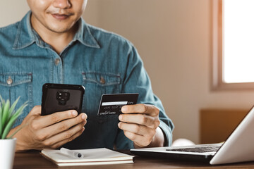 businessmen use their credit cards through mobile internet banking apps to shop online and digital payment ideas.