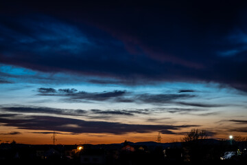 Sunset over the city with dramatic clouds