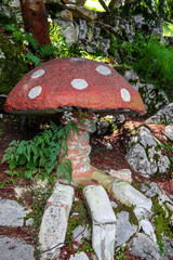 Big red mushroom with white dots in the forest
