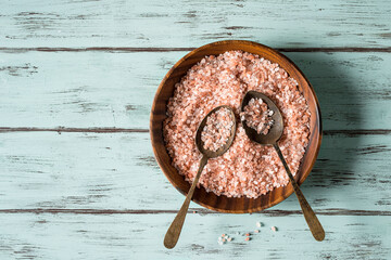 Pink salt in a wooden bowl