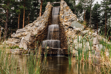 Long exposure of small waterfall in the middle of forest