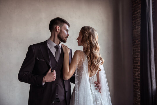 beautiful young couple. groom and bride. a modern wedding. dark interior