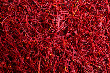 Naklejka premium Aromatic dried saffron as background, top view