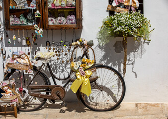 Fototapeta na wymiar Traditional Apulian souvenirs on display outside a shop in Alberobello. Apulia, Italy