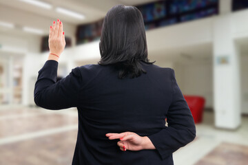 Businesswoman fake oath gesture fingers crossed behind back