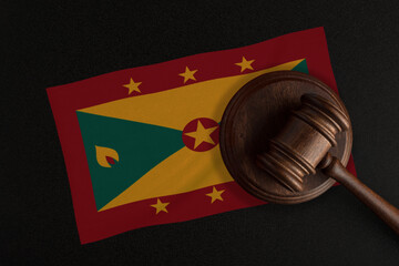 Judges gavel and the flag of Grenada. Law and Justice. Constitutional law