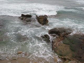 waves crashing on rocks
