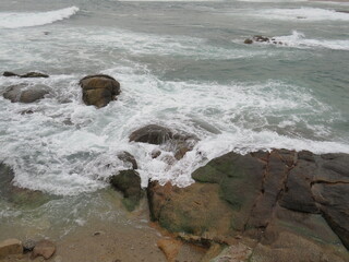 waves breaking on the rocks