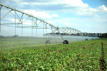 Center pivot irrigation system watering agricultural field
