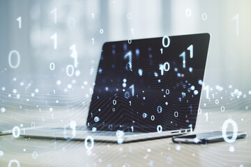 Creative concept of binary code illustration on modern laptop background. Big data and coding concept. Multiexposure
