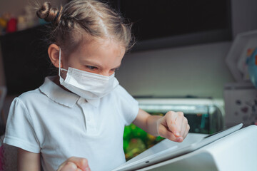 Caucasian preteen girl with medical mask on her face concentrate