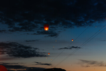 In the evening, at sunset, people with their relatives and friends launch traditional lanterns. Tradition and travel