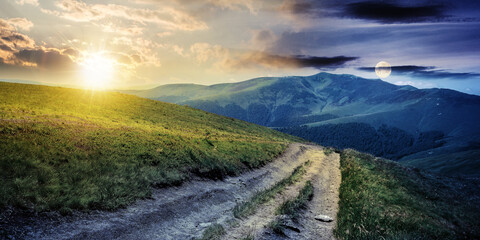 day and night time change concept above the mountain landscape in spring. path through meadow in...