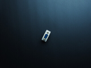 Fototapeta premium White dvi-vga connector on dark background.