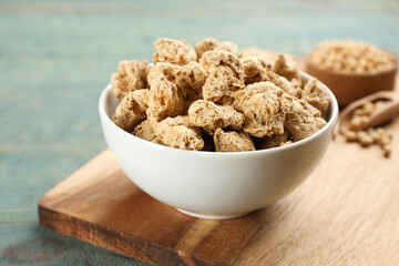 Dried soy meat on light blue wooden table, closeup