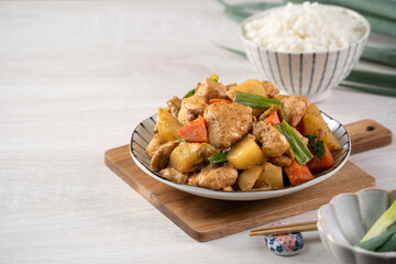 Homemade delicious cubed chicken with braised potato chunks.