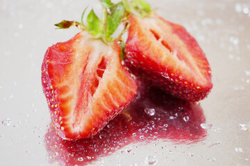 group strawberries with strawberry leaf on silver background