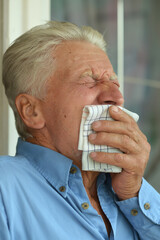 Portrait of sad sick senior man