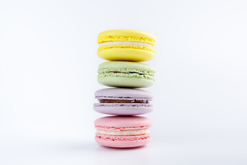 Stack of colorful macaroons on a white background