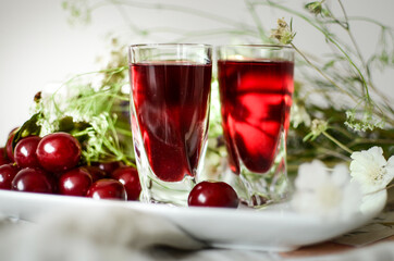glass of red wine and flowers