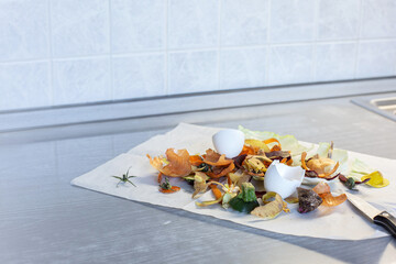 Food waste on kitchen table. Closeup. Selective focus. Copy space.