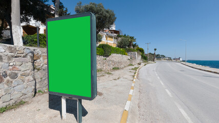 Blank black board near the sea for you text and advertising