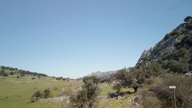 High Pan Left of Grassy Valley in Sierra de Grazalema Mountains of Cadiz, Spain