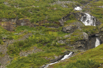 Waterfall with many cascades at geiranger fjord