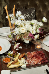 snack table decorated with white wedding flowers
