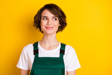 Photo of gorgeous satisfied person smile look interested empty space imagine isolated on yellow...