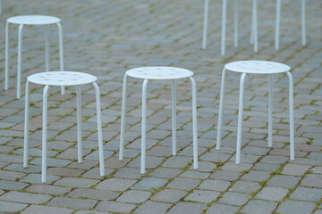 stool in a row on street