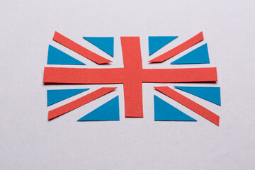 The flag of Great Britain cut out from the blue and red paper.