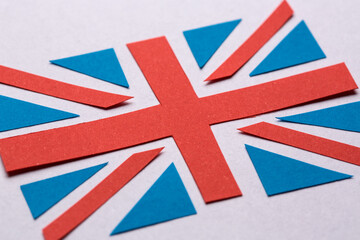 The flag of Great Britain cut out from the blue and red paper.
