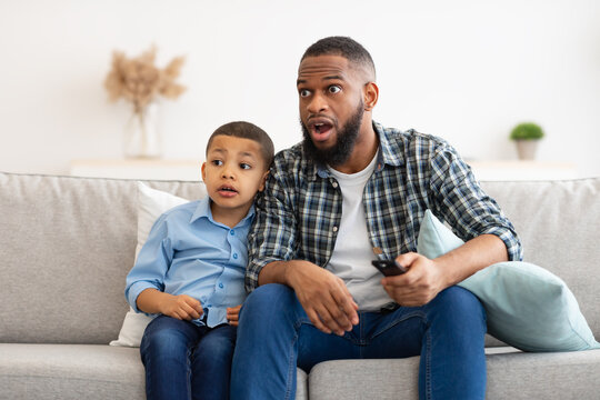 Confused Dad And Son Watching TV, Switching Questionable Content Indoor