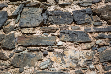Architecture textures, detailed rusty and rustic old wall masonry schist