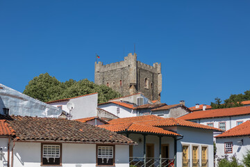 View at the interior fortress medieval village, portuguese classic vernacular buildings and Castle of Braganca as background, iconic monument building at the Braganca city
