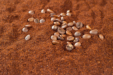Fototapeta na wymiar Coffee beans close up. Texture of ground and grain coffee.