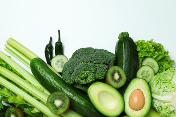 Fresh green vegetables on white background, space for text