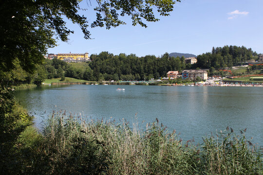 Lavarone lake in foreground with the Grand hotel in background. Folgaria upland. Trentino, italy