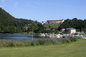 Lavarone lake in foreground with the Grand hotel in background. Folgaria upland. Trentino, italy
