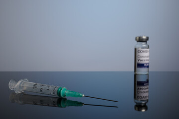 Covid vaccine with inoculation syringe with copyspace. Covid-19 vaccination set with syringe and...