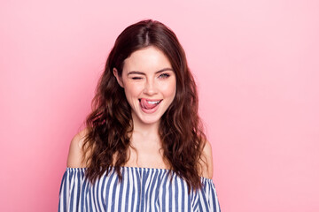 Photo of nice optimistic brunette lady tongue out wear blue dress isolated on pastel pink color background