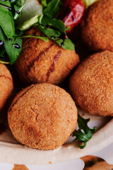 Beautiful falafel balls and fresh salad. Close-up.