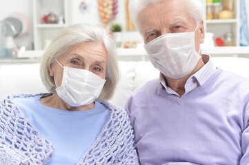 Portrait of sick  elderly woman and man  with facial masks