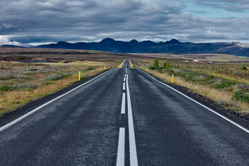 Highway on the background of Iceland mountains