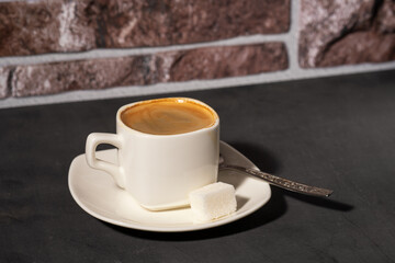 a cup of morning coffee on a dark background selective focus